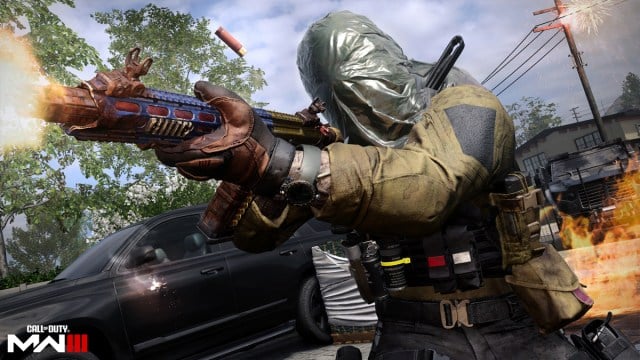 A player aims a colorful weapon and fires in front of a car on Shoot House in Call of Duty Modern Warfare 3.