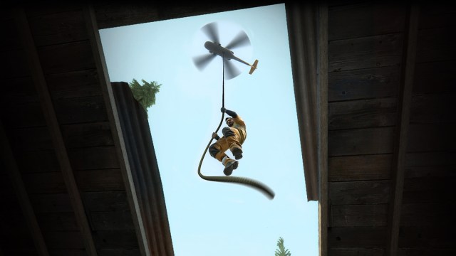 A player drops into a building via a helicopter rope in CS:GO's Danger Zone.