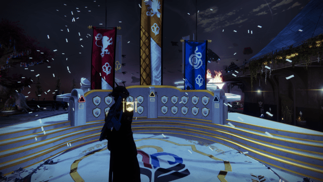 A Warlock standing in front of the Guardian Games podium in the Tower.