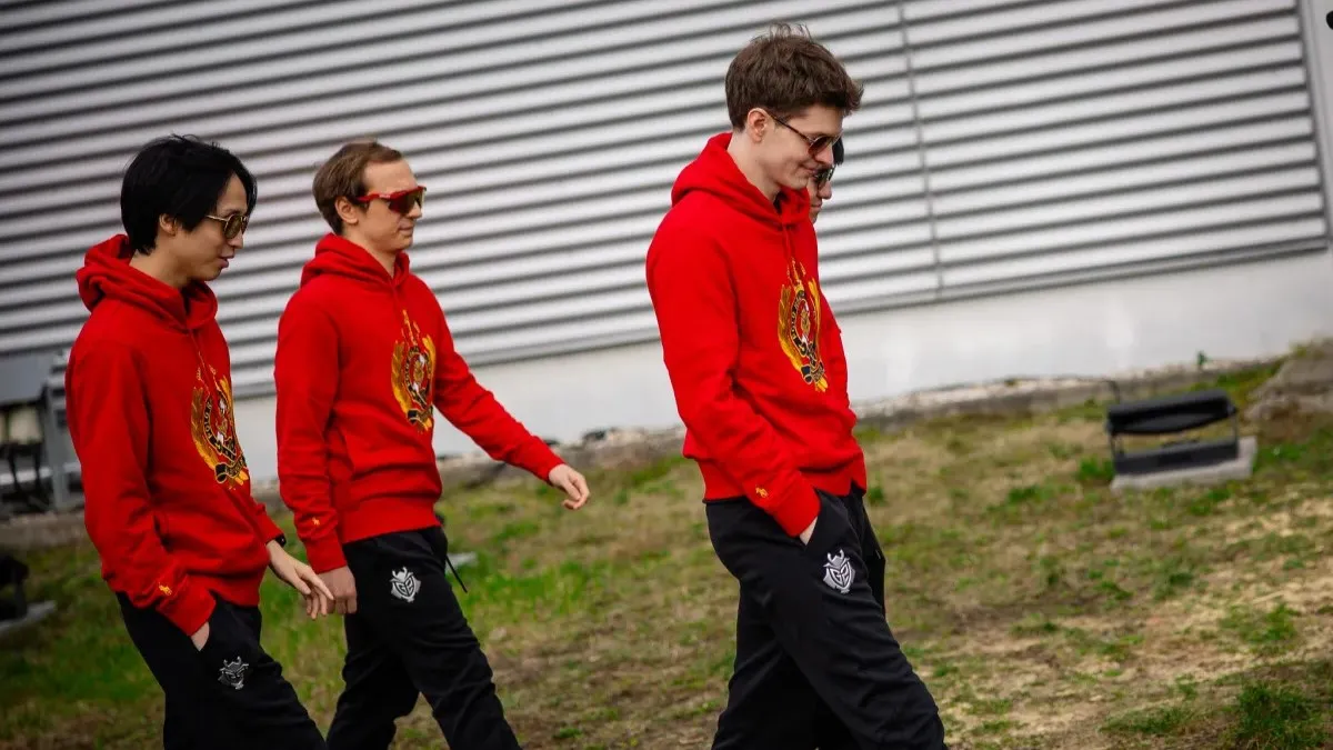 A photo of G2 players walking with red hoodies