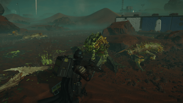 A slew of dead Terminid bugs next to an Autocannon-wielding Helldivers 2 player.