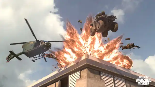 Warzone Mobile action screenshot of a helicopter and ATV with an explosion.