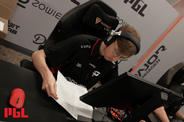 Kauez, a player for Imperial, reads over notes at the PGL Copenhagen Major Americas RMR.