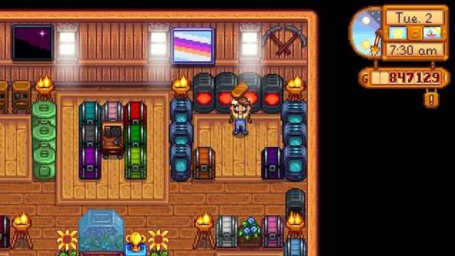 The player holding a Copper Bar in front of Furnaces cooking Copper Bars in Stardew Valley.