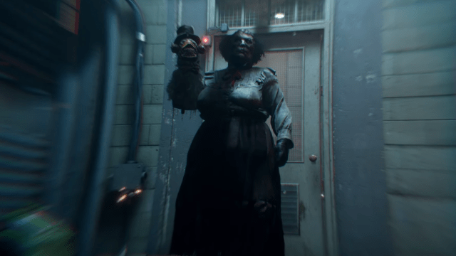 Mother Gooseberry standing outside a door with her hand puppet in The Outlast Trials.