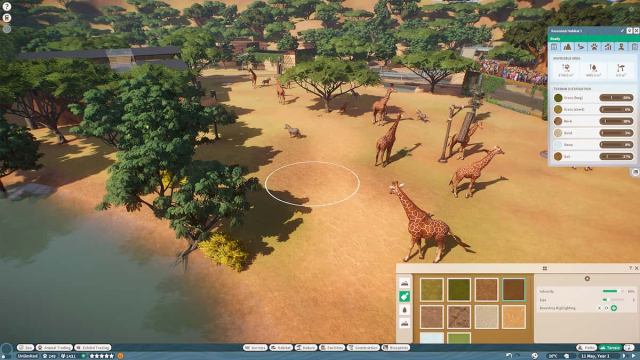 Players painting tyhe ground in Planet Zoo.