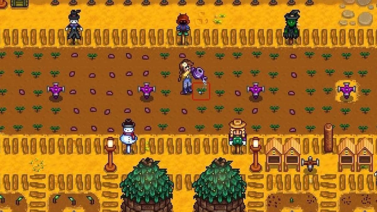 The player standing by many Sprinklers that just watered crops in Stardew Valley.