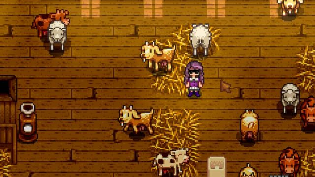 Player inside the barn and surrounded by cows and sheep in Stardew Valley.