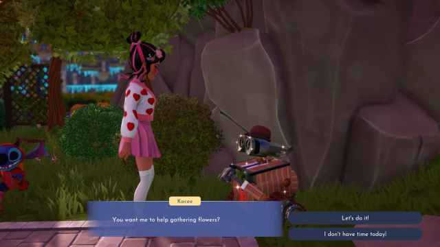 The player talking with Wall-E about flowers in Disney Dreamlight Valley.