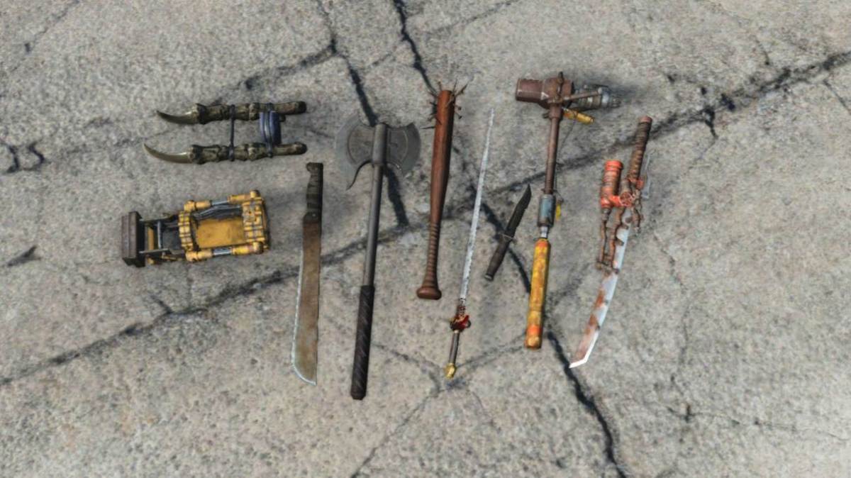 An assortment of bladed and blunt melee weapons scattered on broken pavement in Fallout 4.