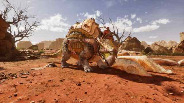 A player riding a tamed Morellatops in Ark: Survival Ascended Scorched Earth