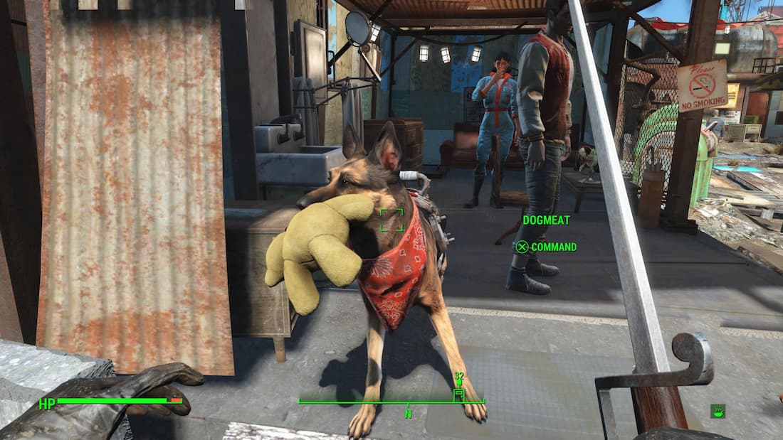 An in game screenshot of Dogmeat playing with a teddy bear in Fallout 4.