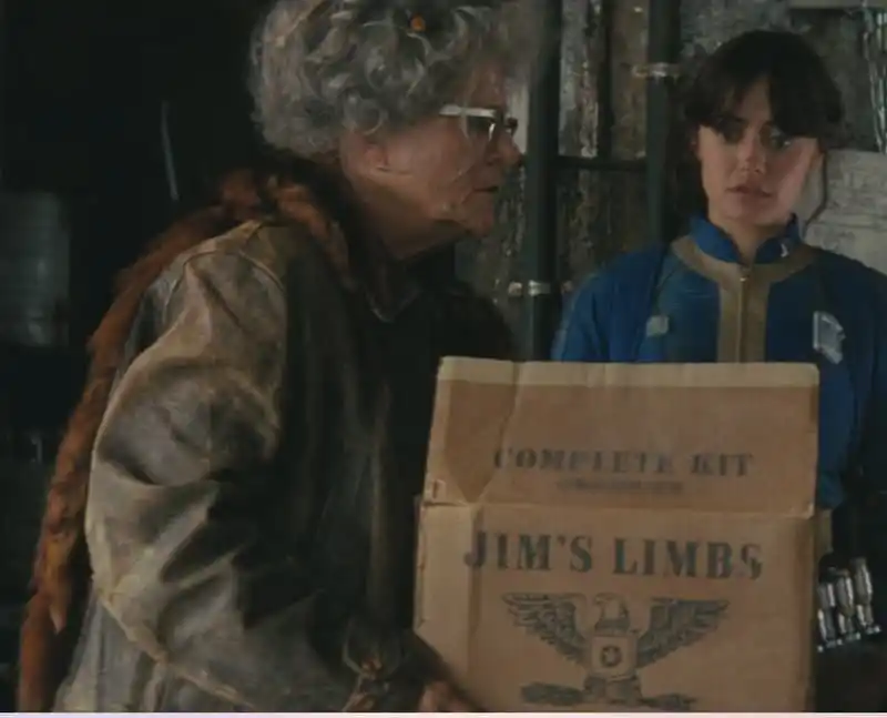Ma June carries a box of Jim's Limbs. Fallout TV Show