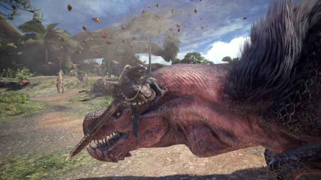 A player in Monster Hunter: World mounted to a creature.