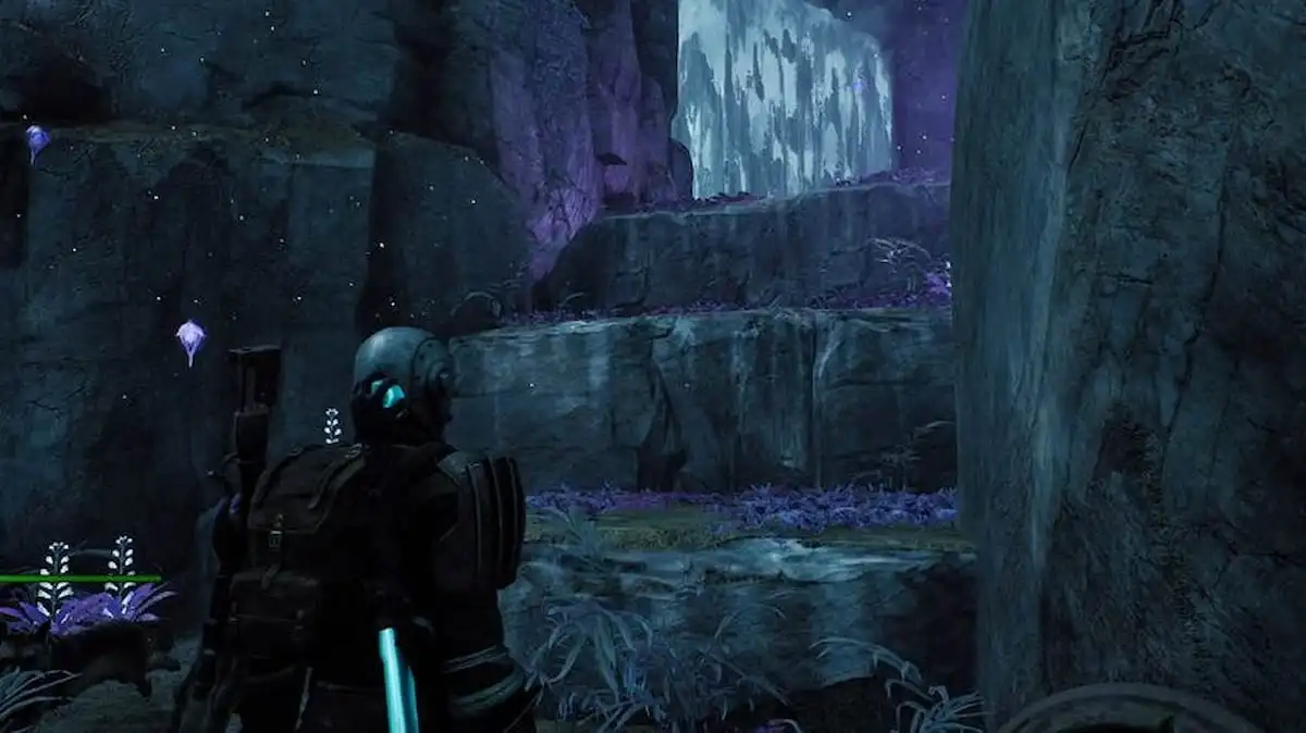 Remnant 2 character is standing in front of a waterfall