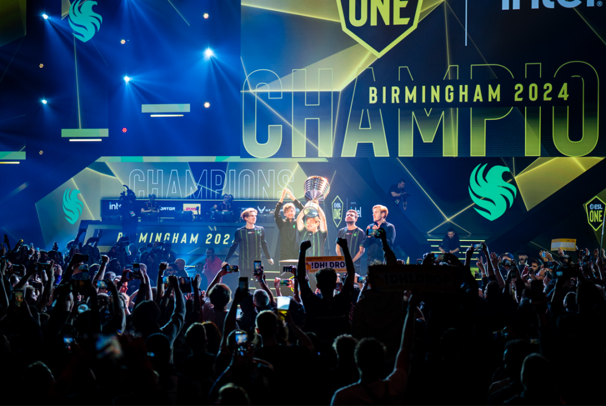Team Falcons lift the trophy in front of the ESL One Birmingham crowd