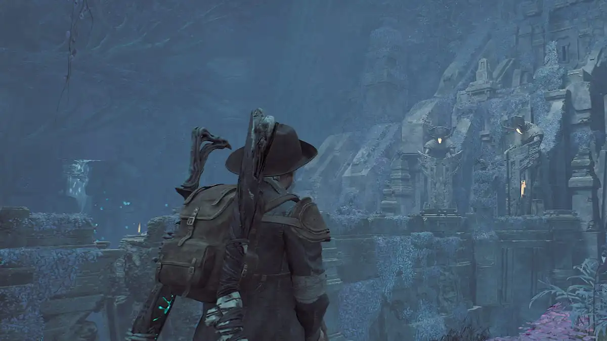 A character looks at distant buildings on a mountainside in Remnant 2.