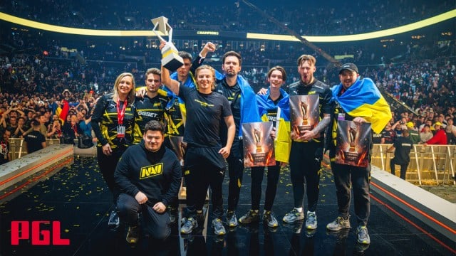The NAVI team stand on stage celebrating with the PGL Copenhagen Major trophy.