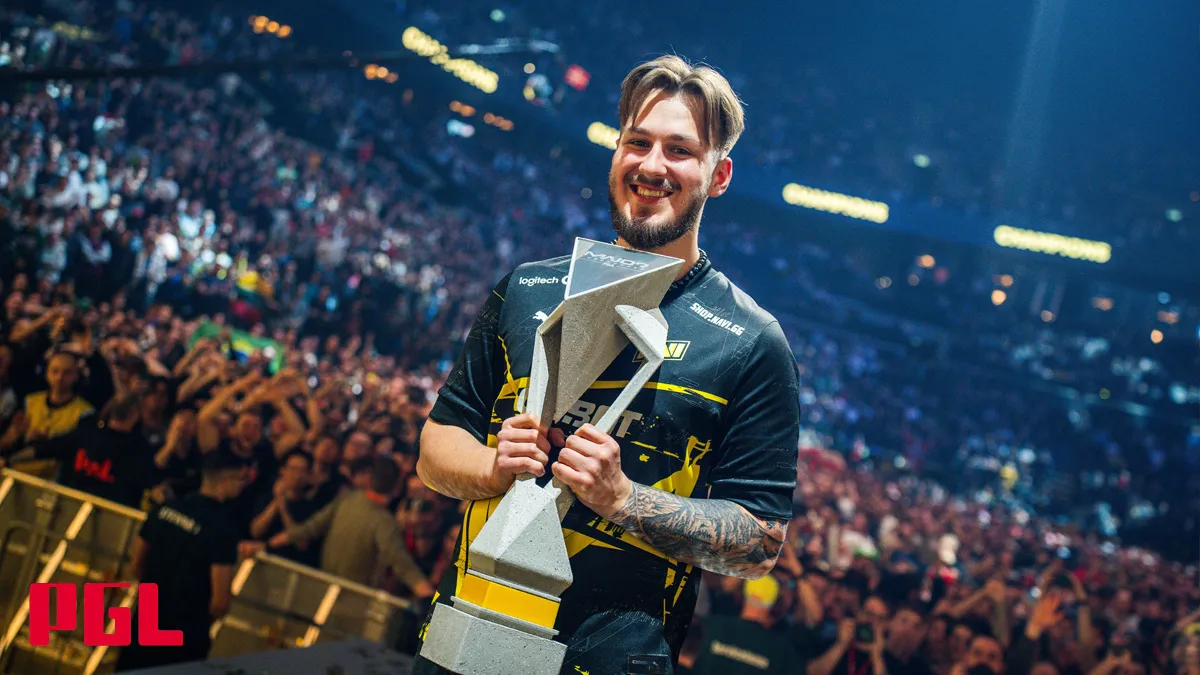 NAVI player jL stands holding a trophy in front of the Royal Arena crowd at the PGL Copenhagen Major.