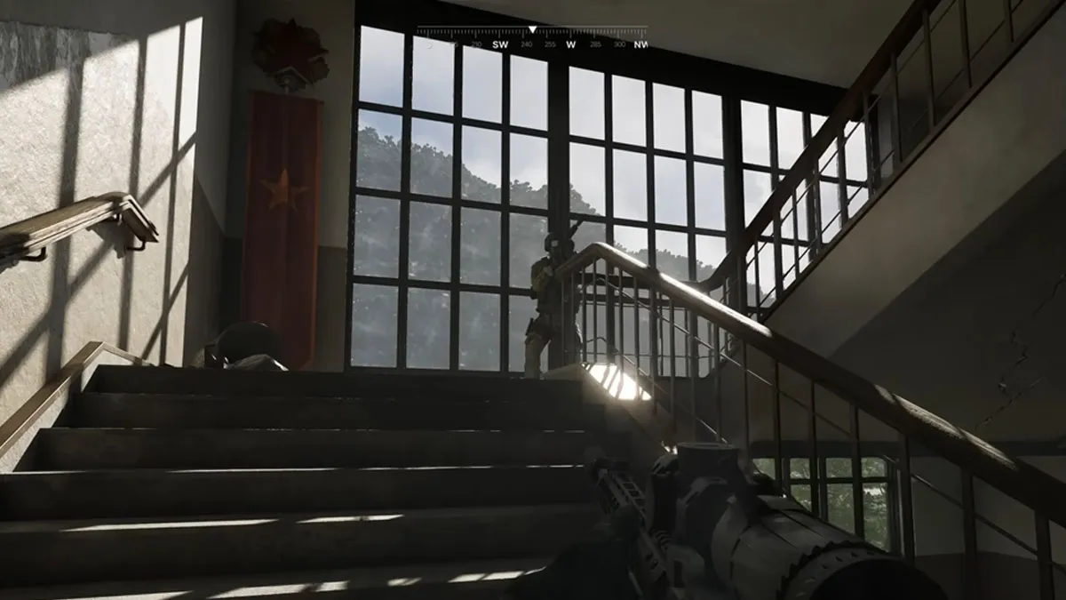 Soldiers walk past a window of a building in Gray Zone Warfare.