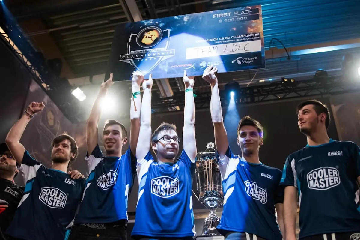 LDLC celebrate with the DreamHack 2014 Major trophy and winner's check.