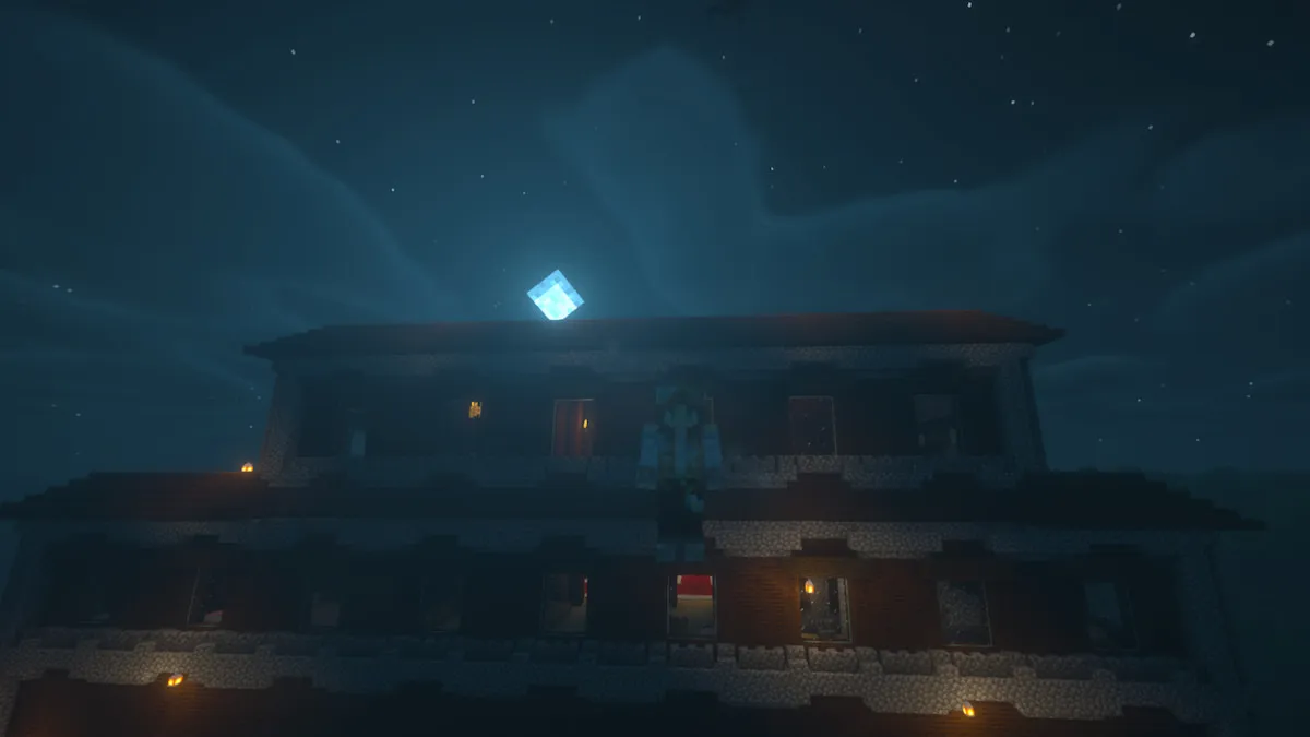 The player floating in front of a woodland mansion at night in Minecraft.