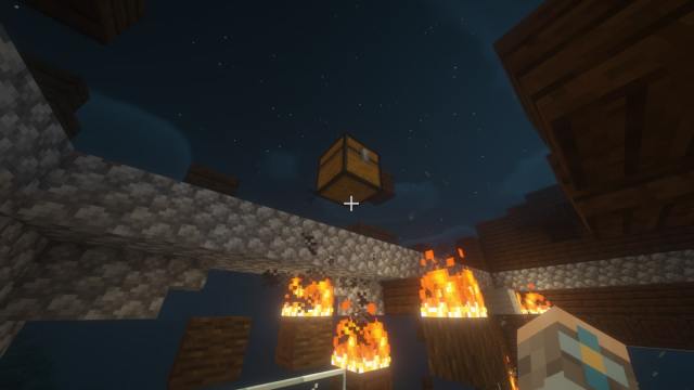 A chest left behind after a Woodland Mansion was set on fire in Minecraft.