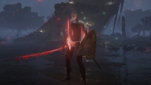 Un Terni, portant très peu d'armure et tenant un katana sanglant, se tient dans un marais d'Elden Ring.