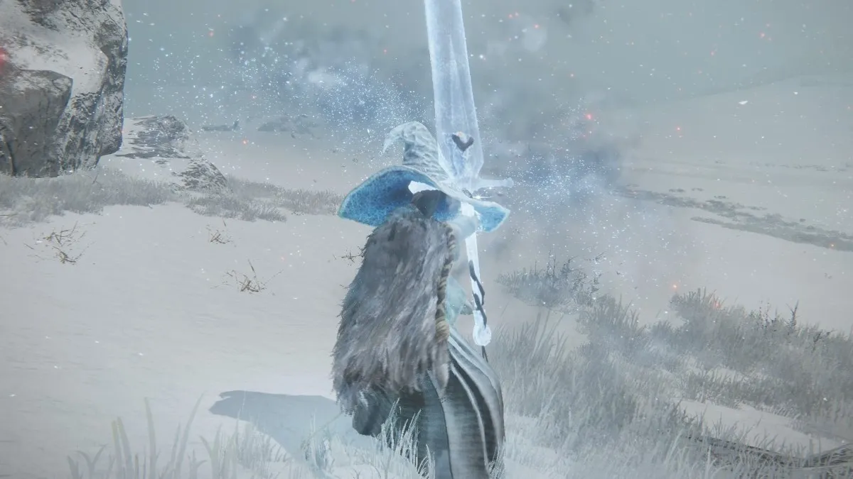 A Tarnished wearing the Frost Witch armor set prepares to fire a Adula's Moonblade in Elden Ring.