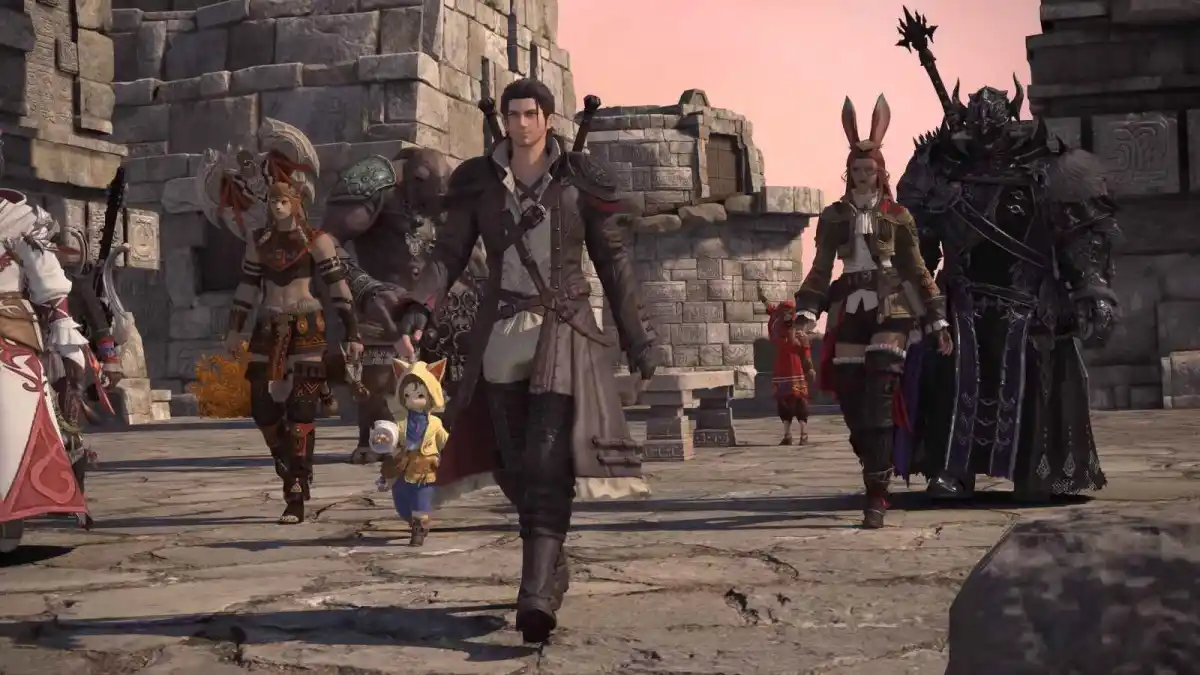 The default male hyur player character of Final Fantasy 14 leads a team of adventurers through a town in Tural, the new setting of Dawntrail.