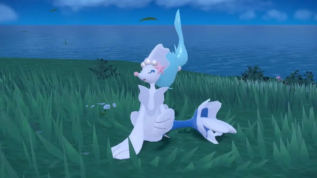 Primarina smiling in the grass in Pokémon Scarlet and Violet.