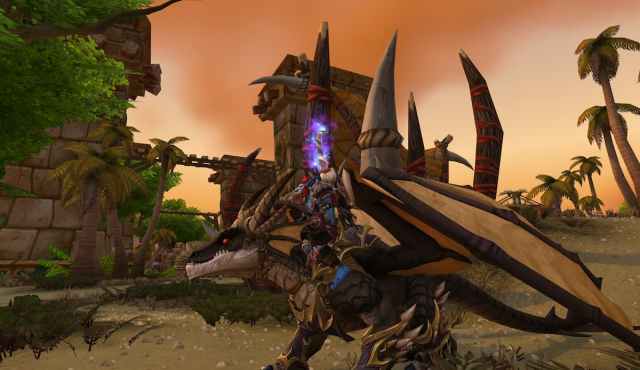 A Troll character wearing the Heritage Armor in WoW Dragonflight while riding a black drake