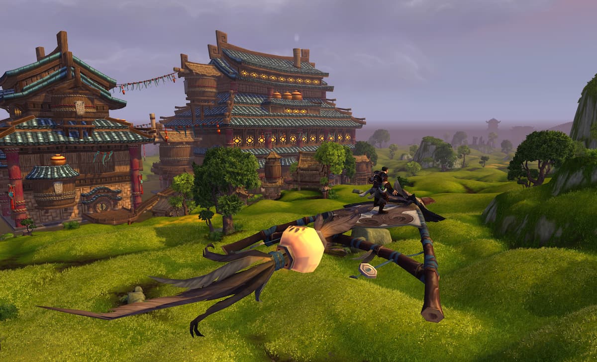 A Rogue flying over the Stormstout Brewery in WoW Mists Remix on a kite