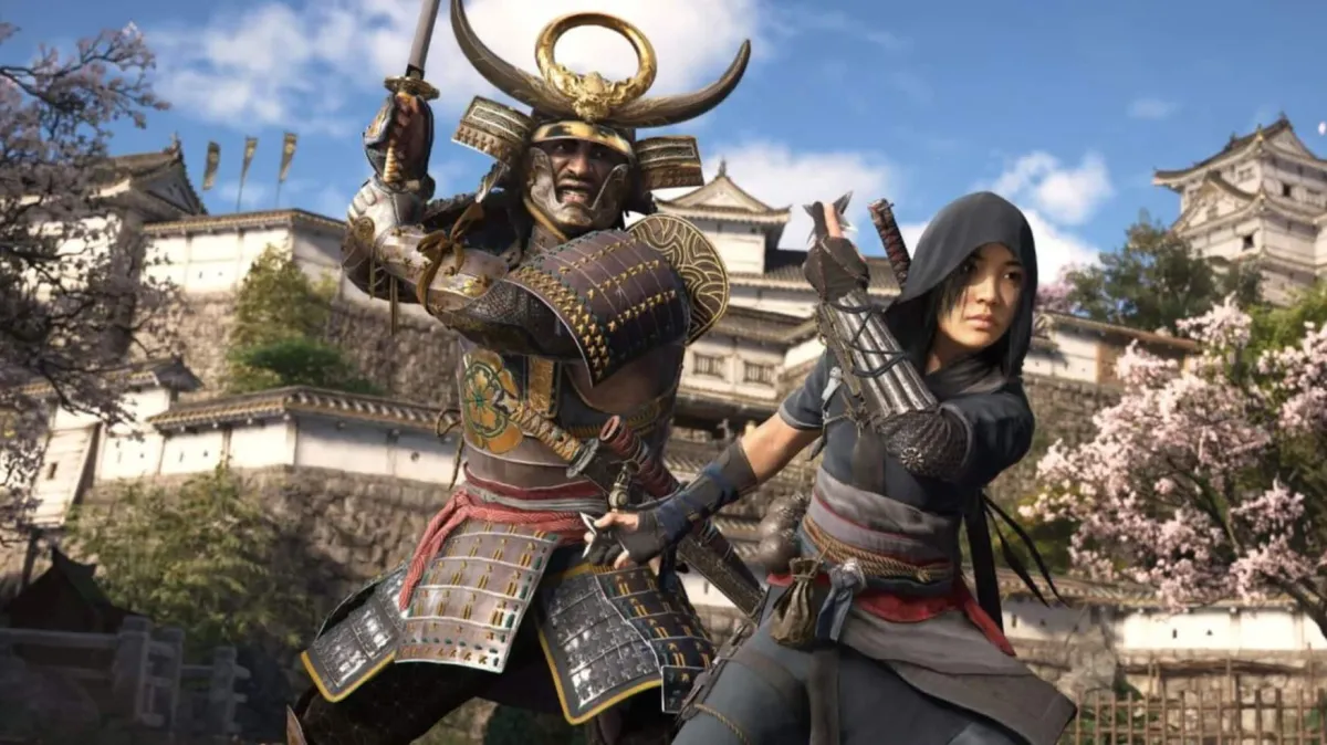 Naoe and Yasuke widl their weapons in front of a feudal Japanese castle.
