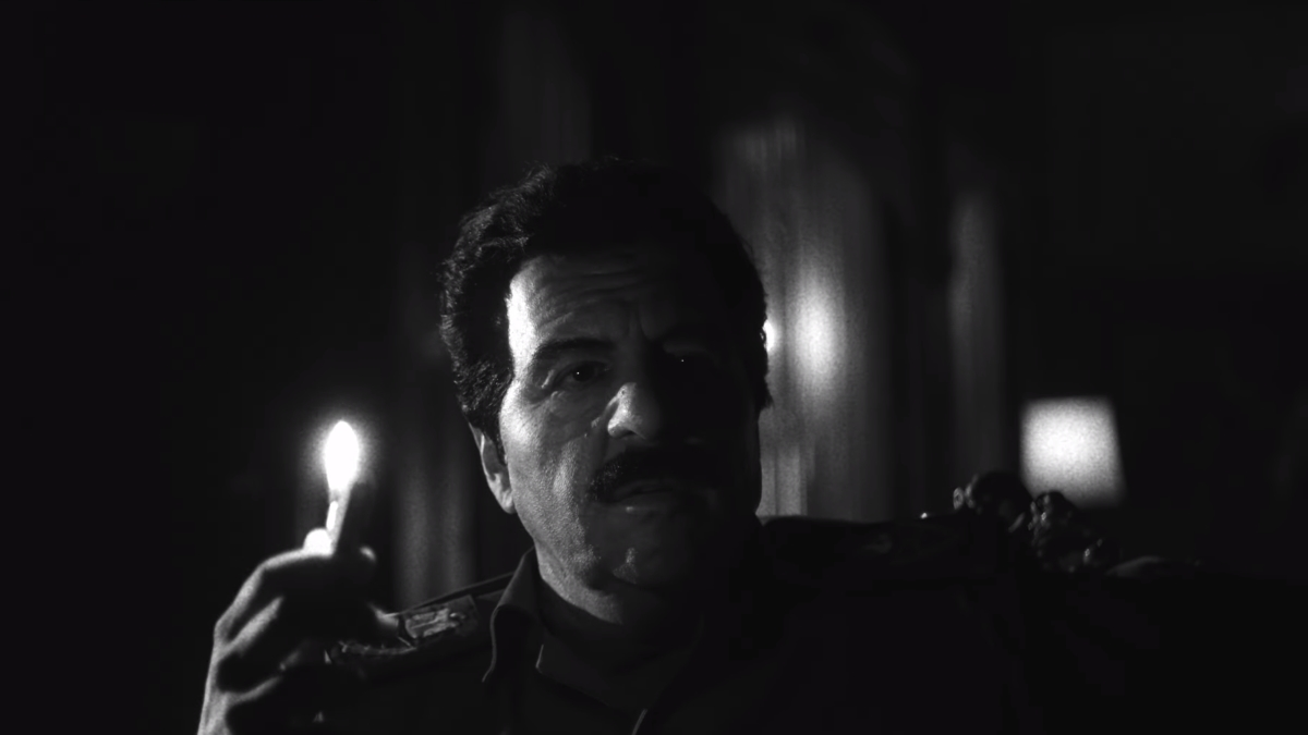 Saddam Hussein holding a lighter in the Black Ops 6 live-action trailer.