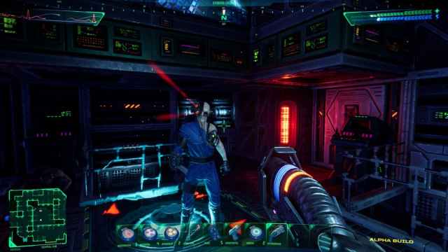 A player holding an alien at a gunpoint in System Shock.