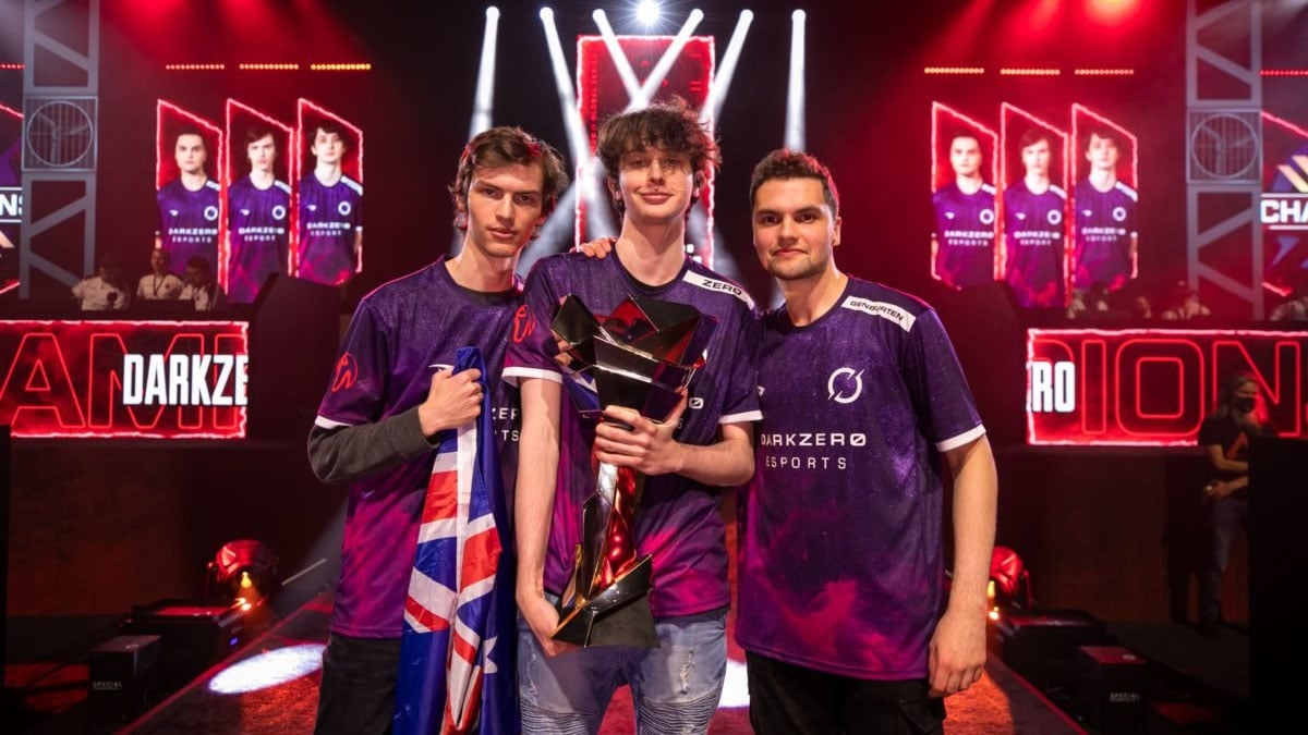 The DarkZero squad hold the 2022 ALGS Championship trophy on-stage.