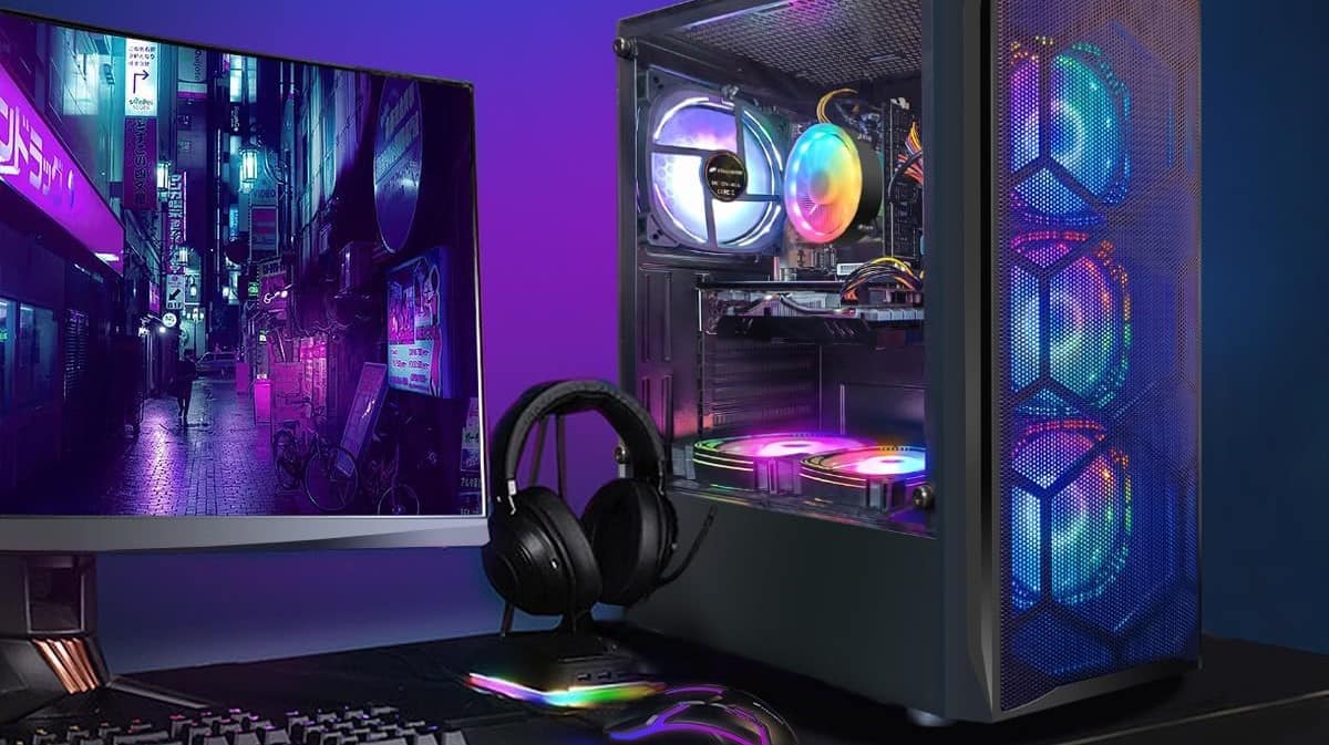 Black gaming PC, headset, keyboard, mouse, and monitor displaying Cyberpunk 2077