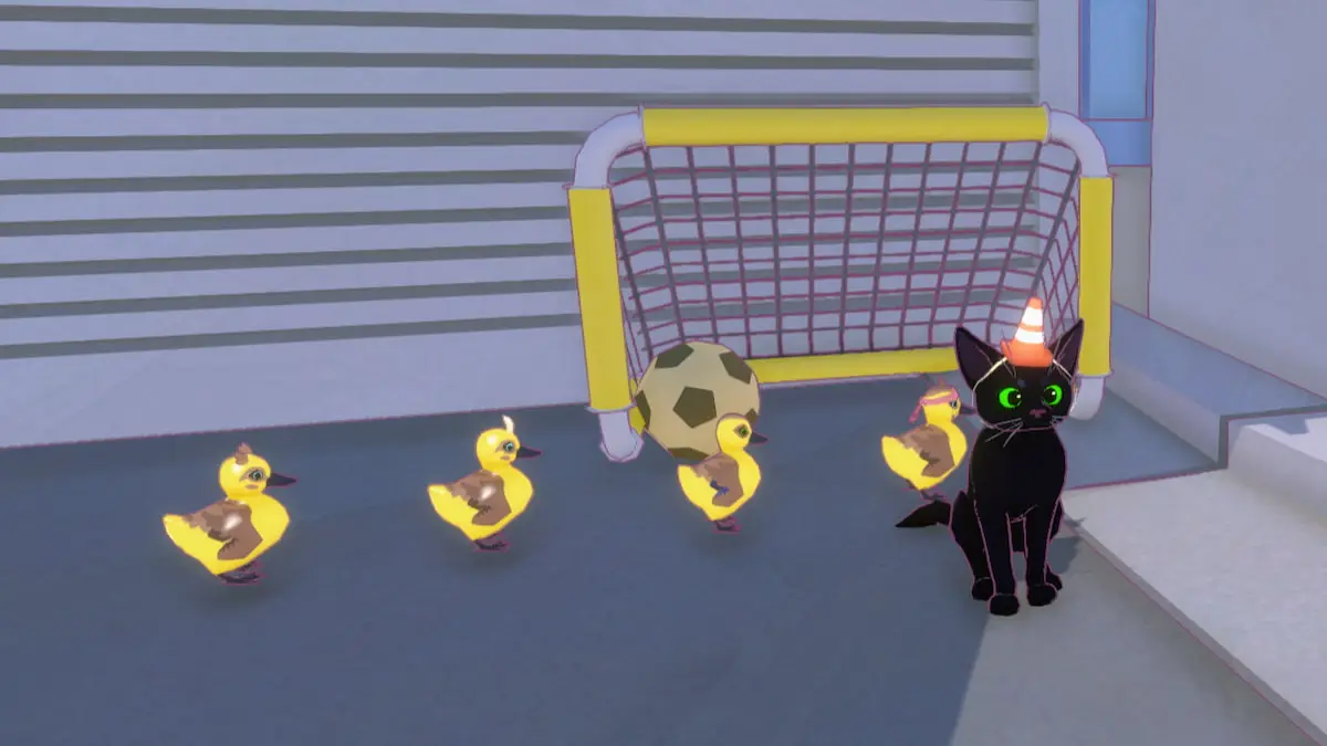 The cat sitting by a soccer ball and goal with ducklings in Little Kitty, Big City.