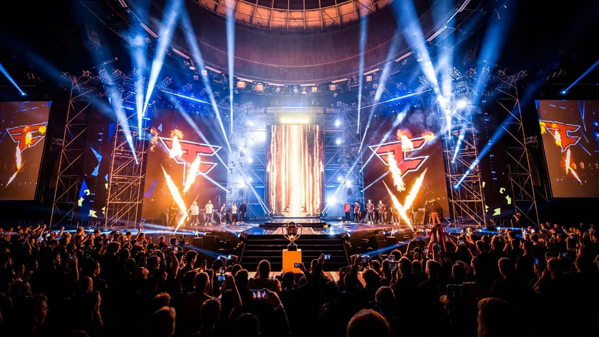 The Spodek Arena stage lights up in front of fans for the IEM Katowice 2024 grand final.