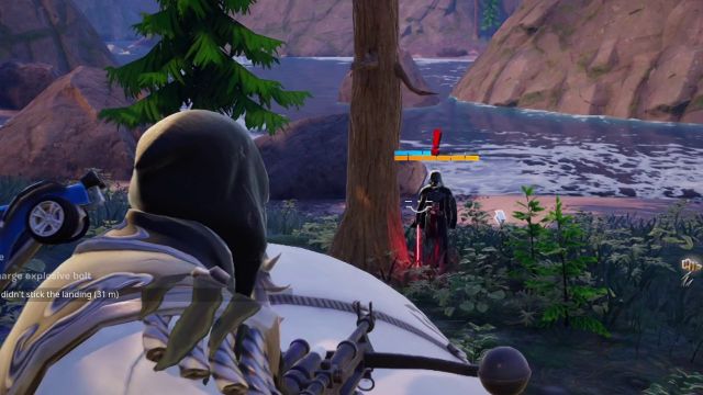 The player character in Fortnite attacking Darth Vader.