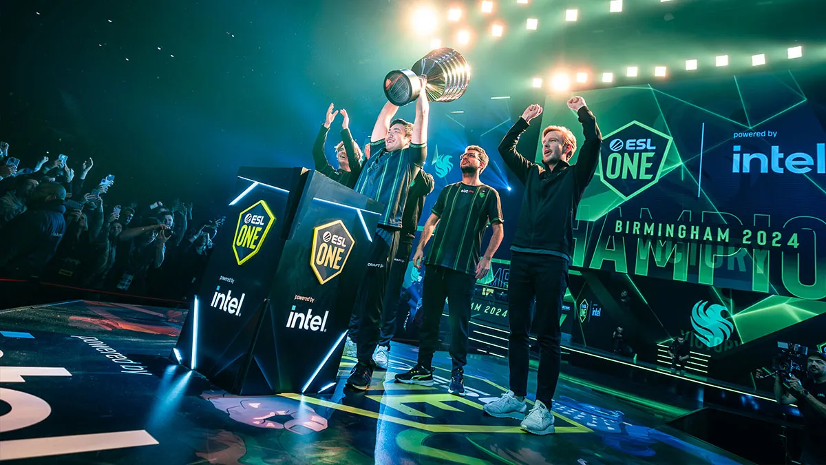 The Falcons Dota 2 roster lift the ESL One Birmingham trophy after they win.