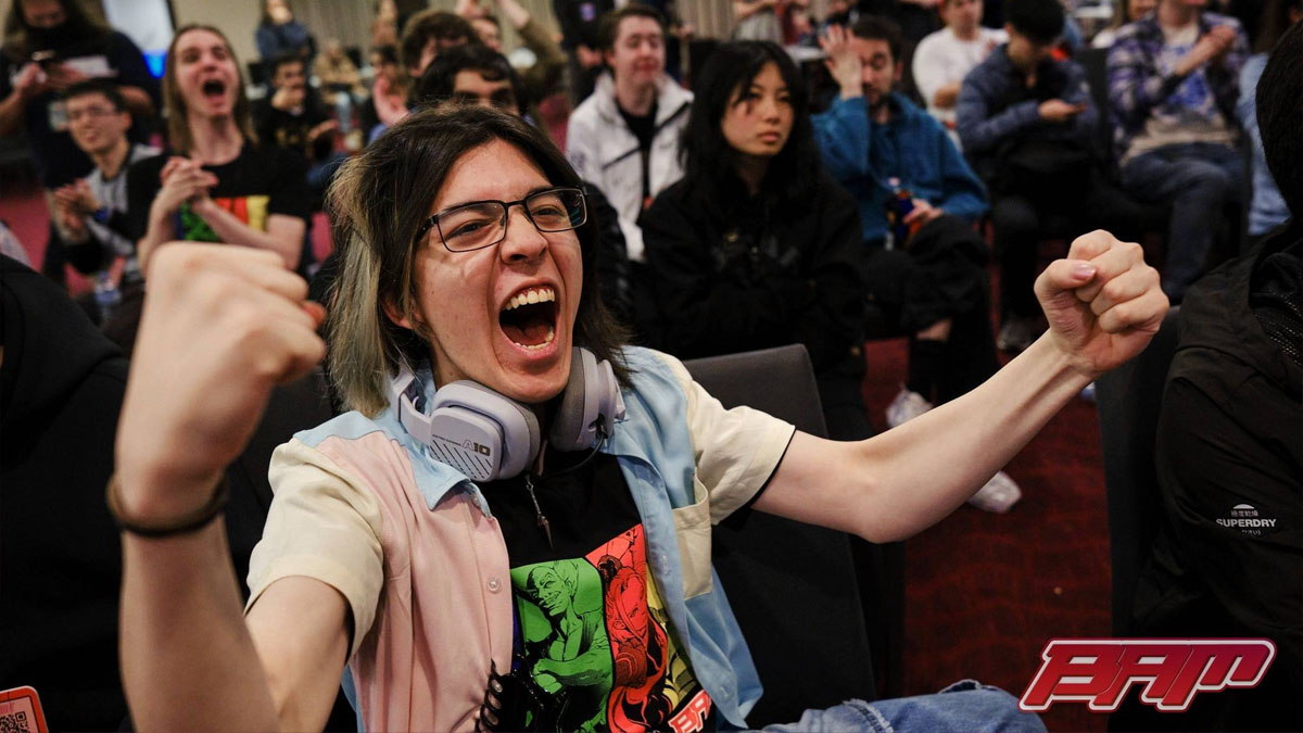 A spectator at BAM13 cheers in a crowd after a FGC match.