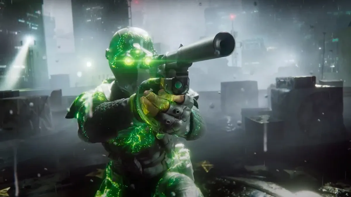 An XDefiant character with glowing green eyes, pointing a weapon to an enemy.