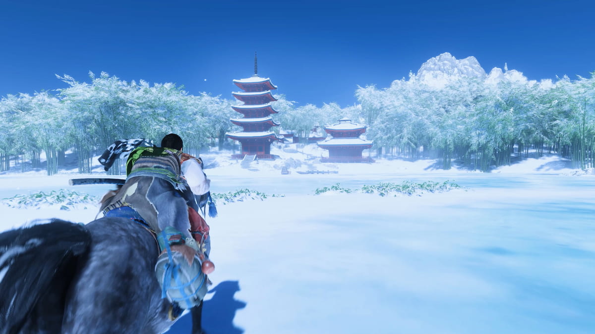 Jin riding through the snow in Ghost of Tsushima