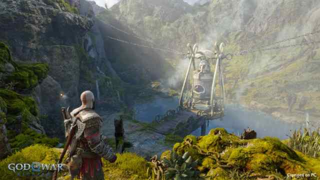Kratos in a lush landscape in God of War Ragnarok