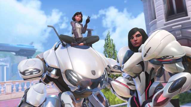 D.Va posing next to Pharah with their Porsche collab skins in OW2