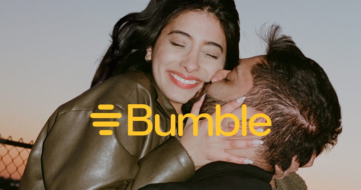 A couple sharing a kiss on the cheek with the yellow Bumble logo overlaid across their faces