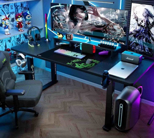 Klobel X-Win Electric Height Adjustable Standing Desk with a full PC build and a monitor displaying a girl, in a blue room