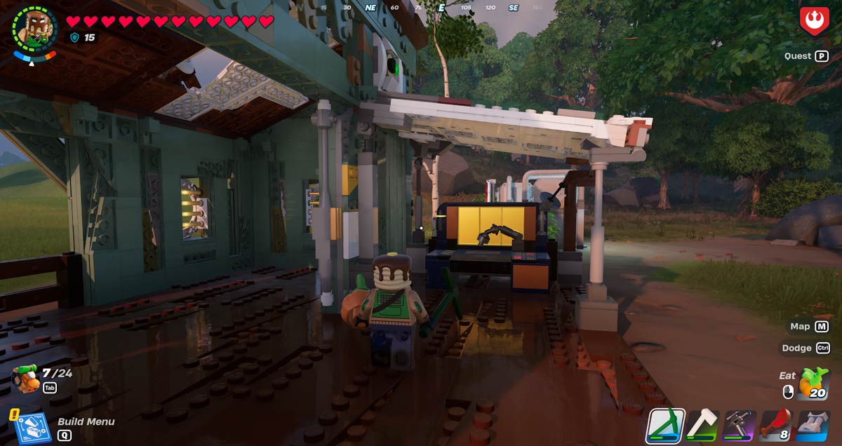 Player with a pickaxe and pumpkin equipped standing next to the Rebel Workbench in LEGO Fortnite.